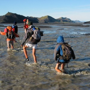 Crossing iceland river by foot